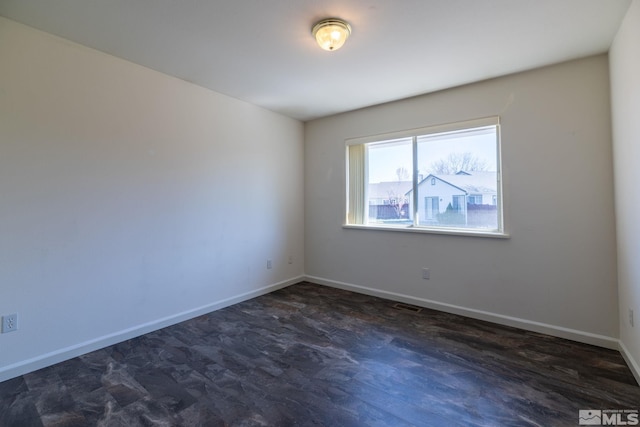 1784 Mahogany Cir, Minden, NV 89423 - empty room featuring baseboards and dark wood-style floors
