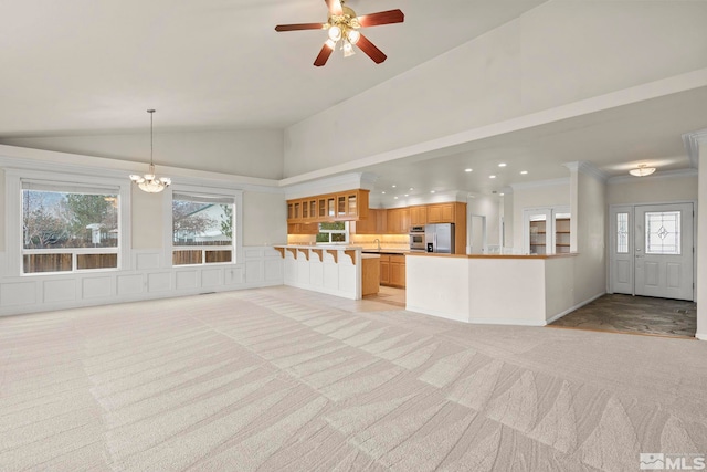 1147 Country Club Dr, Minden, NV 89423 - unfurnished living room featuring light carpet, plenty of natural light, vaulted ceiling, a ceiling fan, and recessed lighting