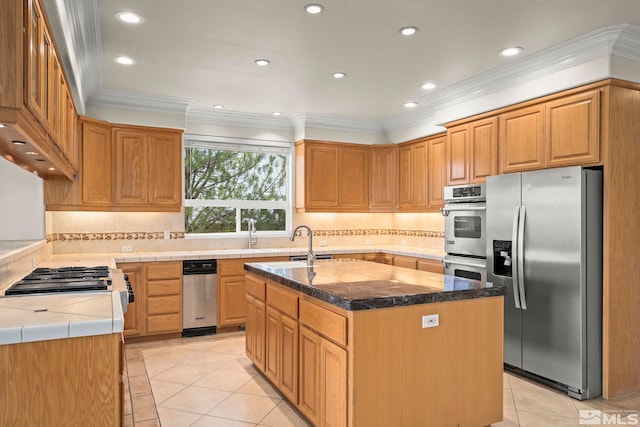 1147 Country Club Dr, Minden, NV 89423 - kitchen with appliances with stainless steel finishes, light tile patterned floors, crown molding, a kitchen island with sink, and recessed lighting
