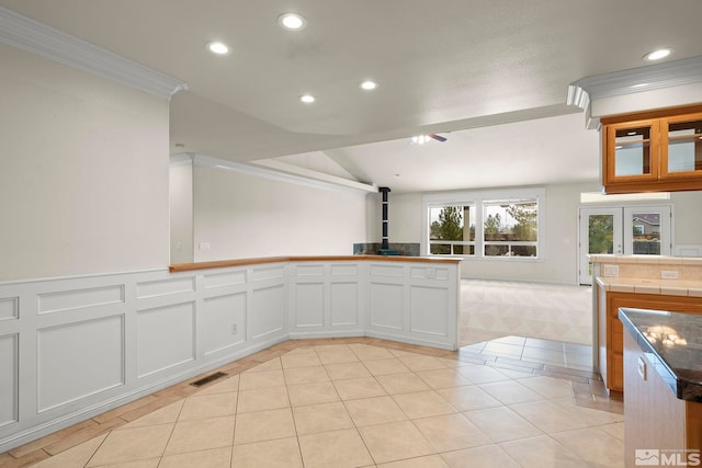 1147 Country Club Dr, Minden, NV 89423 - kitchen featuring a wood stove, recessed lighting, open floor plan, ornamental molding, and light tile patterned floors