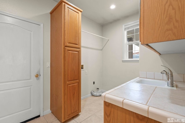 1147 Country Club Dr, Minden, NV 89423 - laundry room featuring cabinet space, hookup for an electric dryer, light tile patterned floors, hookup for a washing machine, and recessed lighting
