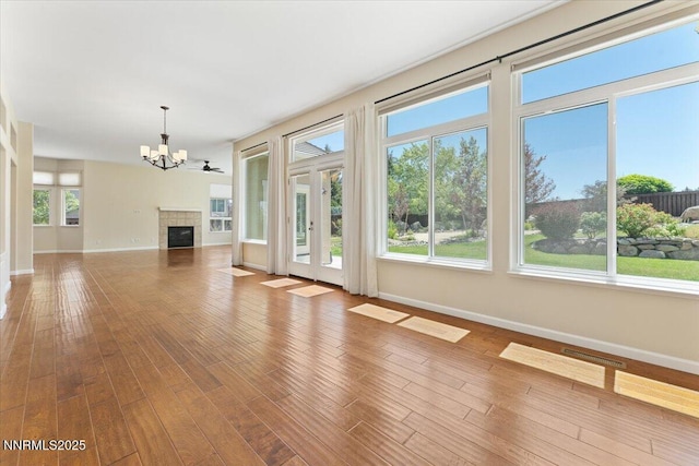 5024 E Albuquerque Rd, Reno, NV 89511 - unfurnished living room featuring a chandelier, wood finished floors, and a fireplace