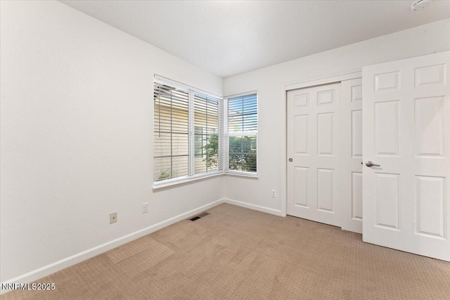 5024 E Albuquerque Rd, Reno, NV 89511 - unfurnished bedroom with light carpet and a closet