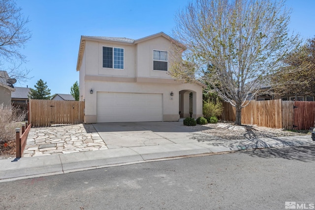 503 Windchase Dr, Dayton, NV 89403 - traditional-style home featuring an attached garage, fence, stucco siding, and concrete driveway
