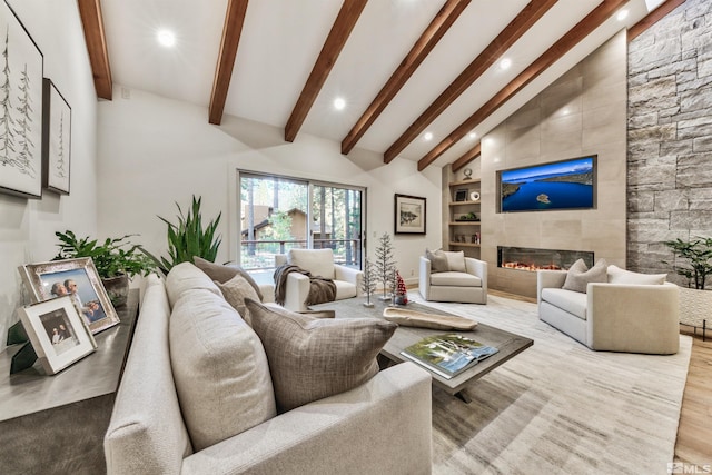 150 Juanita Unit 2, Incline Village, NV 89451 - living area with recessed lighting, built in shelves, beamed ceiling, a tiled fireplace, and high vaulted ceiling