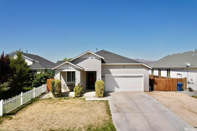 1480 Shadow Ln, Fernley, NV 89408 - view of front of property featuring an attached garage, driveway, and fence