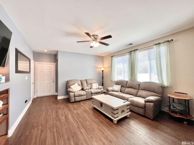 1480 Shadow Ln, Fernley, NV 89408 - living room featuring wood finished floors, a ceiling fan, and baseboards