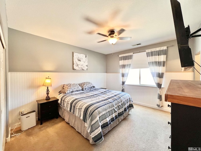 1480 Shadow Ln, Fernley, NV 89408 - bedroom featuring wainscoting, carpet floors, and a ceiling fan