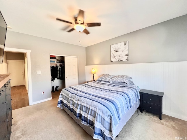 1480 Shadow Ln, Fernley, NV 89408 - bedroom with a closet, light carpet, baseboards, wainscoting, and ceiling fan