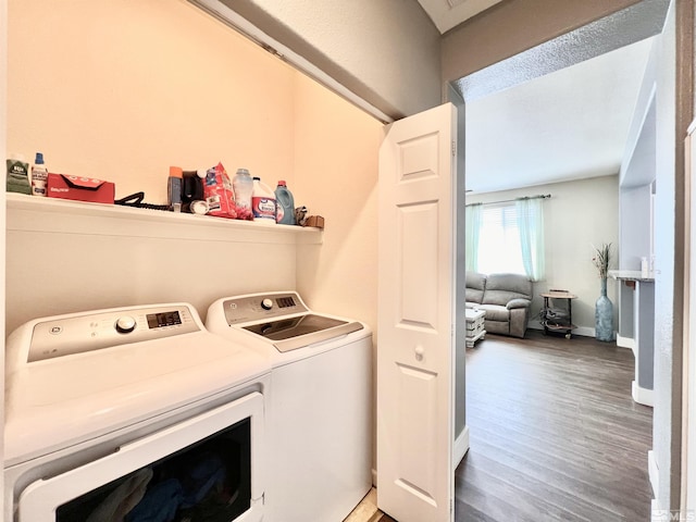 1480 Shadow Ln, Fernley, NV 89408 - laundry room featuring washer and clothes dryer, light wood-style flooring, and baseboards