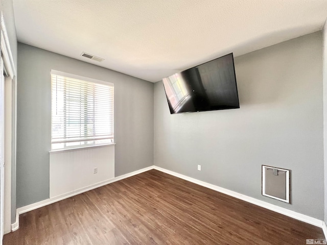 1480 Shadow Ln, Fernley, NV 89408 - unfurnished room featuring dark wood-type flooring and baseboards