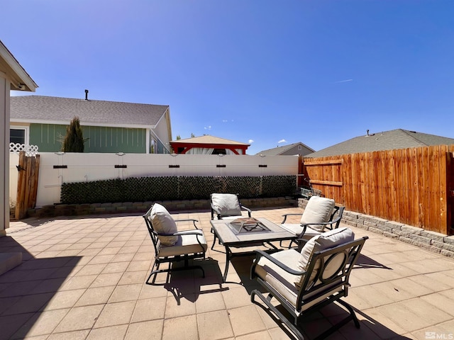 1480 Shadow Ln, Fernley, NV 89408 - view of patio / terrace featuring a fire pit and a fenced backyard