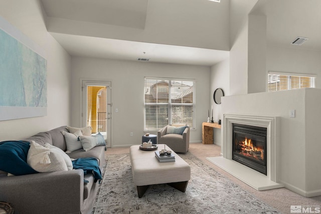 1325 S Meadows Pkwy Unit 322, Reno, NV 89521 - living room featuring carpet, a glass covered fireplace, and baseboards