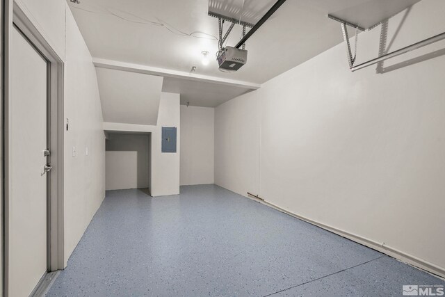 1325 S Meadows Pkwy Unit 322, Reno, NV 89521 - garage with a garage door opener and electric panel