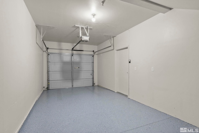 1325 S Meadows Pkwy Unit 322, Reno, NV 89521 - garage featuring a garage door opener and baseboards