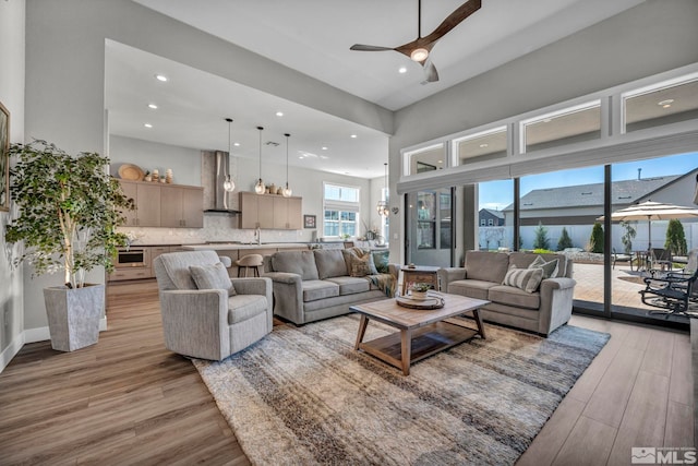 5469 Side Saddle Trl, Reno, NV 89511 - living area with a ceiling fan, light wood finished floors, and recessed lighting