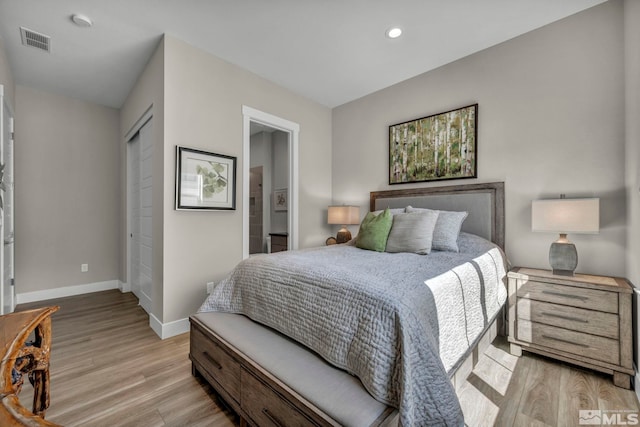 5469 Side Saddle Trl, Reno, NV 89511 - bedroom featuring baseboards, light wood-type flooring, recessed lighting, a closet, and connected bathroom