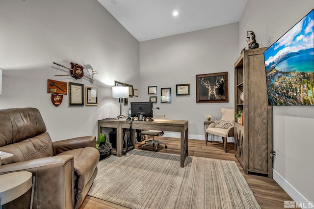 5469 Side Saddle Trl, Reno, NV 89511 - office area featuring wood finished floors, baseboards, high vaulted ceiling, and recessed lighting