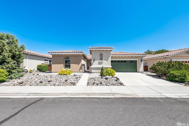 1510 Corleone Dr, Sparks, NV 89434 - mediterranean / spanish home featuring a garage, stucco siding, driveway, and a tile roof