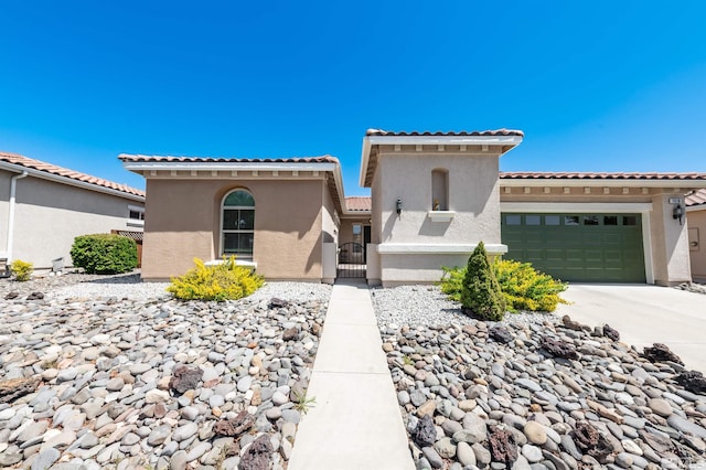 1510 Corleone Dr, Sparks, NV 89434 - mediterranean / spanish home with a tile roof, stucco siding, a garage, and driveway