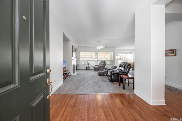 1510 Corleone Dr, Sparks, NV 89434 - entryway with baseboards, wood finished floors, a ceiling fan, and a fireplace
