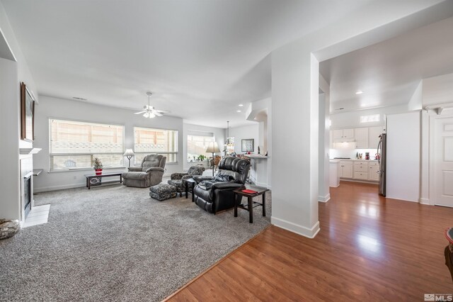 1510 Corleone Dr, Sparks, NV 89434 - living area with a fireplace, healthy amount of natural light, ceiling fan, wood finished floors, and recessed lighting