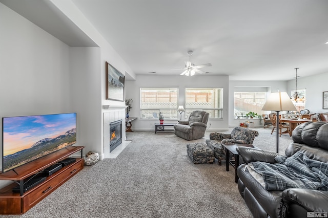 1510 Corleone Dr, Sparks, NV 89434 - carpeted living area with a fireplace, a ceiling fan, and a chandelier