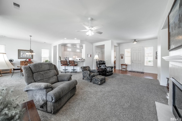 1510 Corleone Dr, Sparks, NV 89434 - living area featuring carpet flooring, a fireplace, and a ceiling fan