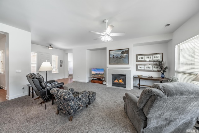 1510 Corleone Dr, Sparks, NV 89434 - living area featuring carpet, a tile fireplace, ceiling fan, and baseboards