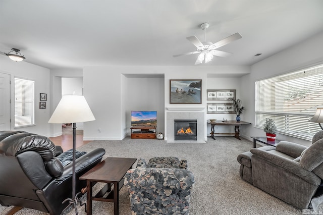 1510 Corleone Dr, Sparks, NV 89434 - living area with healthy amount of natural light, a ceiling fan, a fireplace, and baseboards