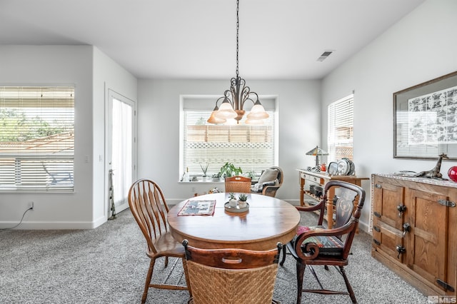 1510 Corleone Dr, Sparks, NV 89434 - carpeted dining area featuring plenty of natural light, baseboards, and a chandelier
