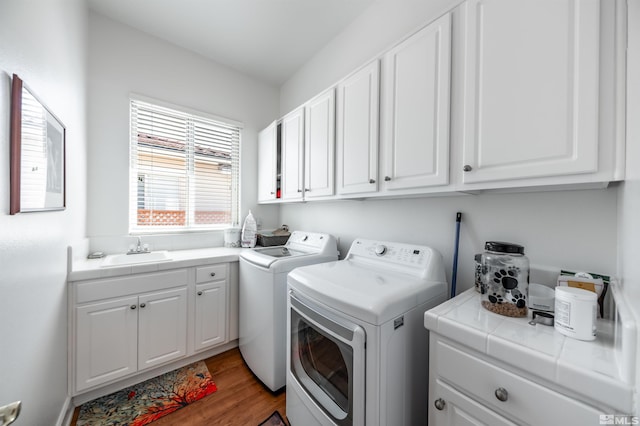 1510 Corleone Dr, Sparks, NV 89434 - laundry room with washing machine and dryer, cabinet space, and wood finished floors