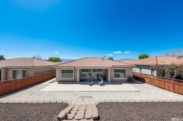 1510 Corleone Dr, Sparks, NV 89434 - back of property featuring stucco siding, a tiled roof, a fenced backyard, and a patio
