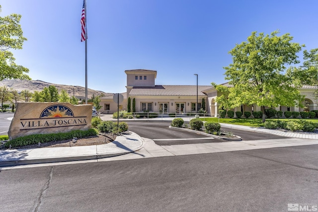 1510 Corleone Dr, Sparks, NV 89434 - view of building exterior featuring a mountain view and uncovered parking