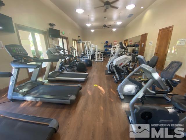 1510 Corleone Dr, Sparks, NV 89434 - exercise room featuring wood finished floors, a ceiling fan, and high vaulted ceiling