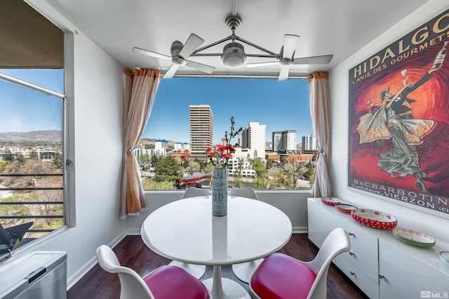 280 Island Ave Unit 904, Reno, NV 89501 - dining room featuring ceiling fan, a skyline view, wood finished floors, and baseboards