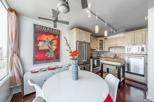280 Island Ave Unit 904, Reno, NV 89501 - dining area with dark wood finished floors, ceiling fan, and rail lighting