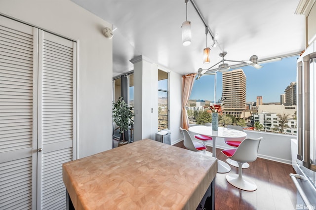 280 Island Ave Unit 904, Reno, NV 89501 - dining area with dark wood-style floors, baseboards, and a city view