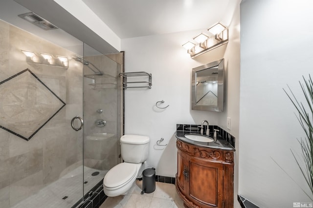 280 Island Ave Unit 904, Reno, NV 89501 - full bath featuring a stall shower, toilet, vanity, and tile patterned flooring