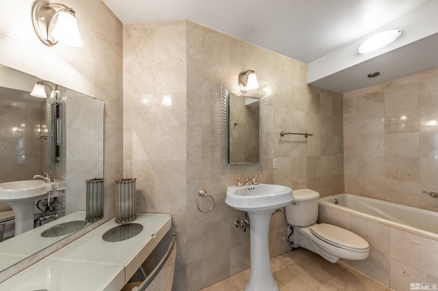 280 Island Ave Unit 904, Reno, NV 89501 - bathroom with tile walls, tiled tub, tile patterned floors, and toilet
