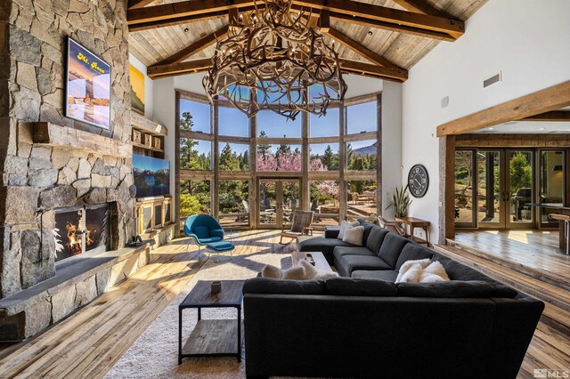 120 W Willis Ln, Reno, NV 89511 - living area featuring french doors, a chandelier, high vaulted ceiling, wood-type flooring, and beam ceiling