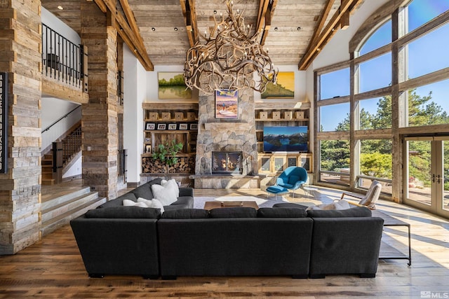 120 W Willis Ln, Reno, NV 89511 - living room with high vaulted ceiling, wood ceiling, a chandelier, a fireplace, and hardwood / wood-style floors