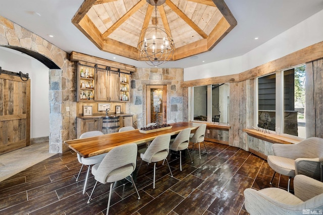 120 W Willis Ln, Reno, NV 89511 - dining area with a barn door, a tray ceiling, wooden ceiling, a chandelier, and wood finished floors
