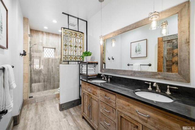 120 W Willis Ln, Reno, NV 89511 - full bathroom with a shower stall, wood finished floors, toilet, double vanity, and recessed lighting
