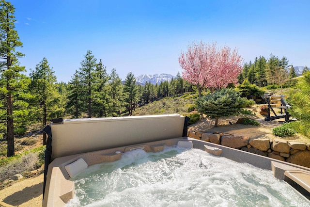 120 W Willis Ln, Reno, NV 89511 - view of patio with a hot tub, a mountain view, and a wooded view