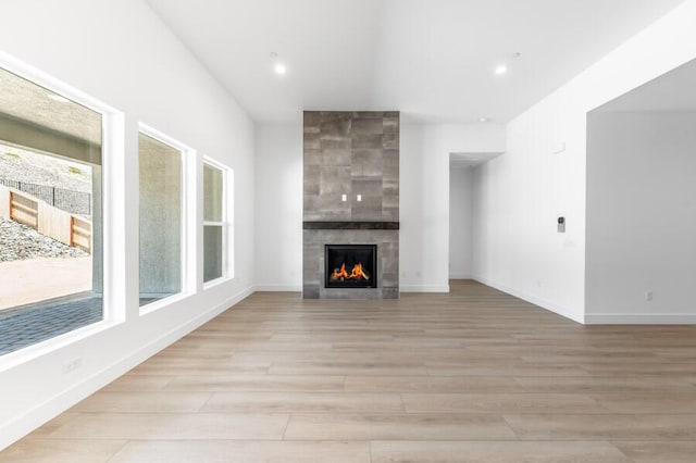 3237 Amaretto Way Unit Cinmon 64, Sparks, NV 89441 - unfurnished living room with a fireplace, light wood-type flooring, recessed lighting, and baseboards