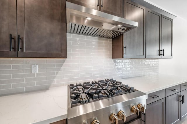 3237 Amaretto Way Unit Cinmon 64, Sparks, NV 89441 - kitchen featuring under cabinet range hood, light stone counters, and tasteful backsplash