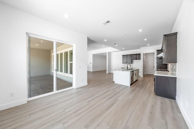 3237 Amaretto Way Unit Cinmon 64, Sparks, NV 89441 - kitchen featuring a sink, light wood finished floors, light countertops, open floor plan, and recessed lighting
