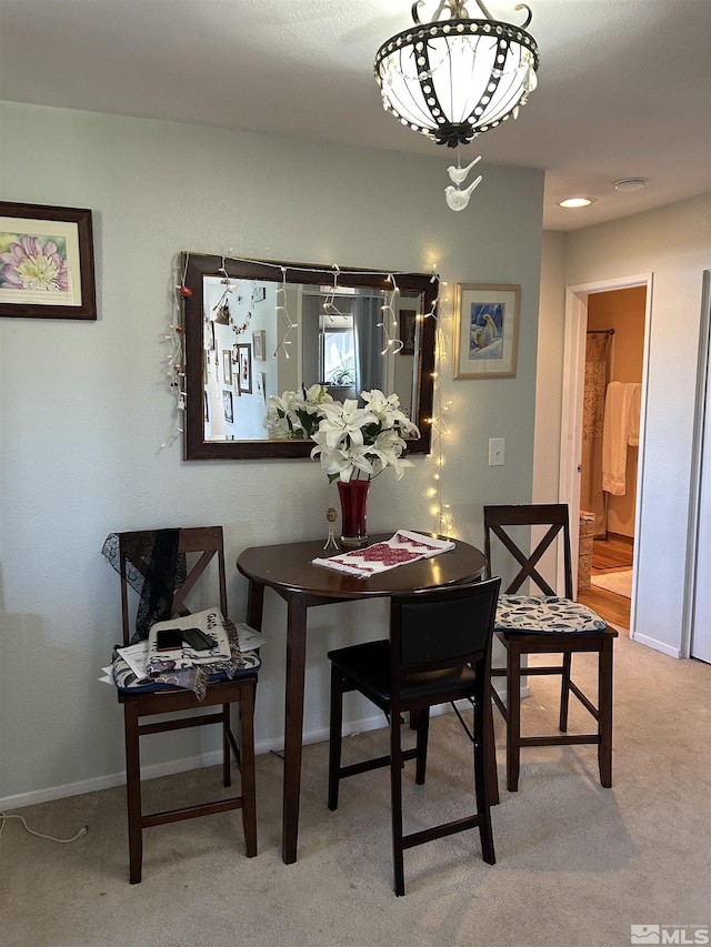 2169 Kietzke Ln Unit E, Reno, NV 89502 - dining space with carpet floors and baseboards