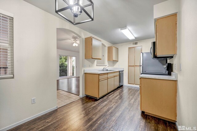 6850 Sharlands Ave Unit A2003, Reno, NV 89523 - kitchen with stainless steel appliances, dark wood-style flooring, light countertops, and a sink